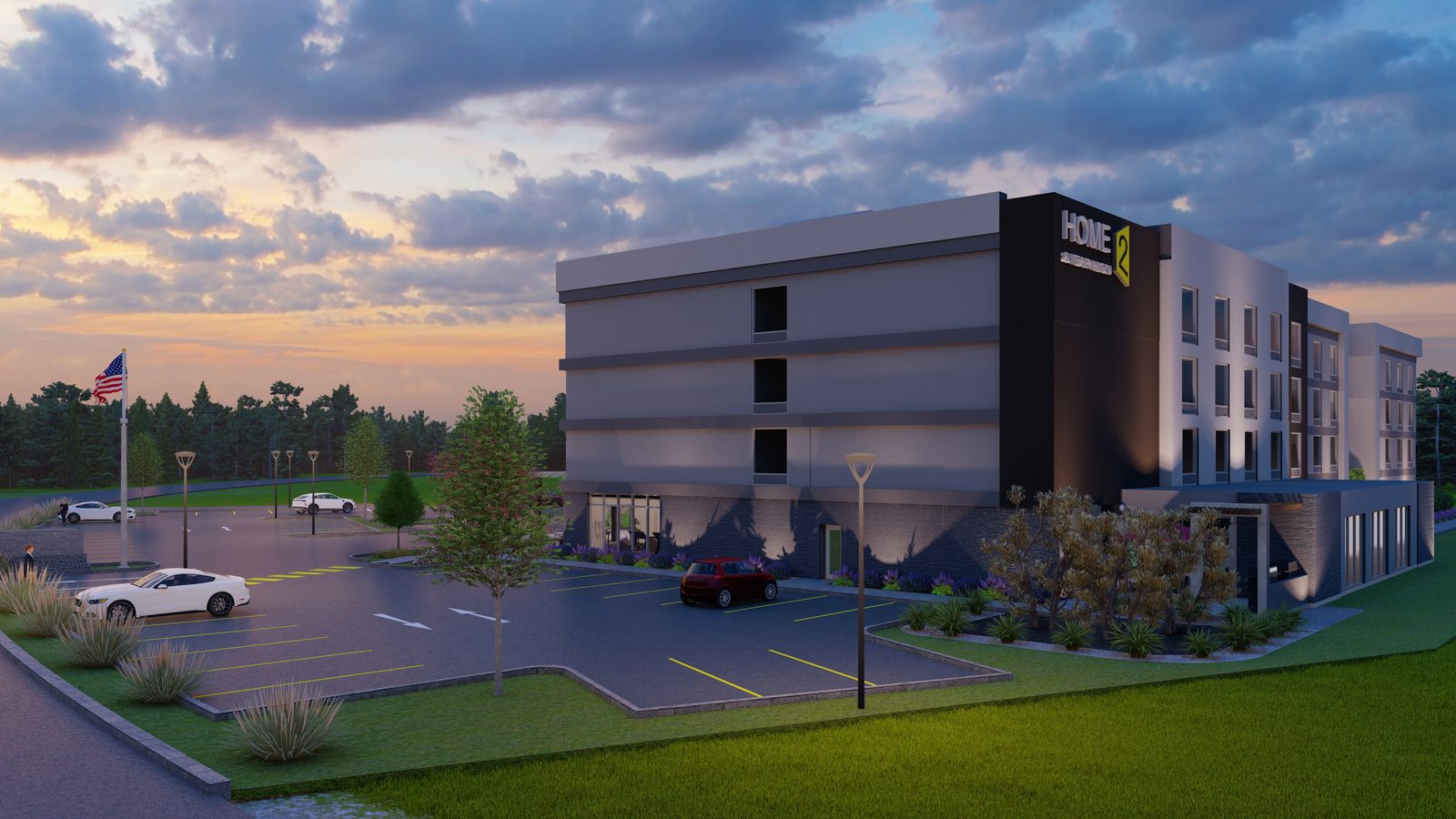 Dusk rendering of the rear corner with parking, landscaping and a US flag.