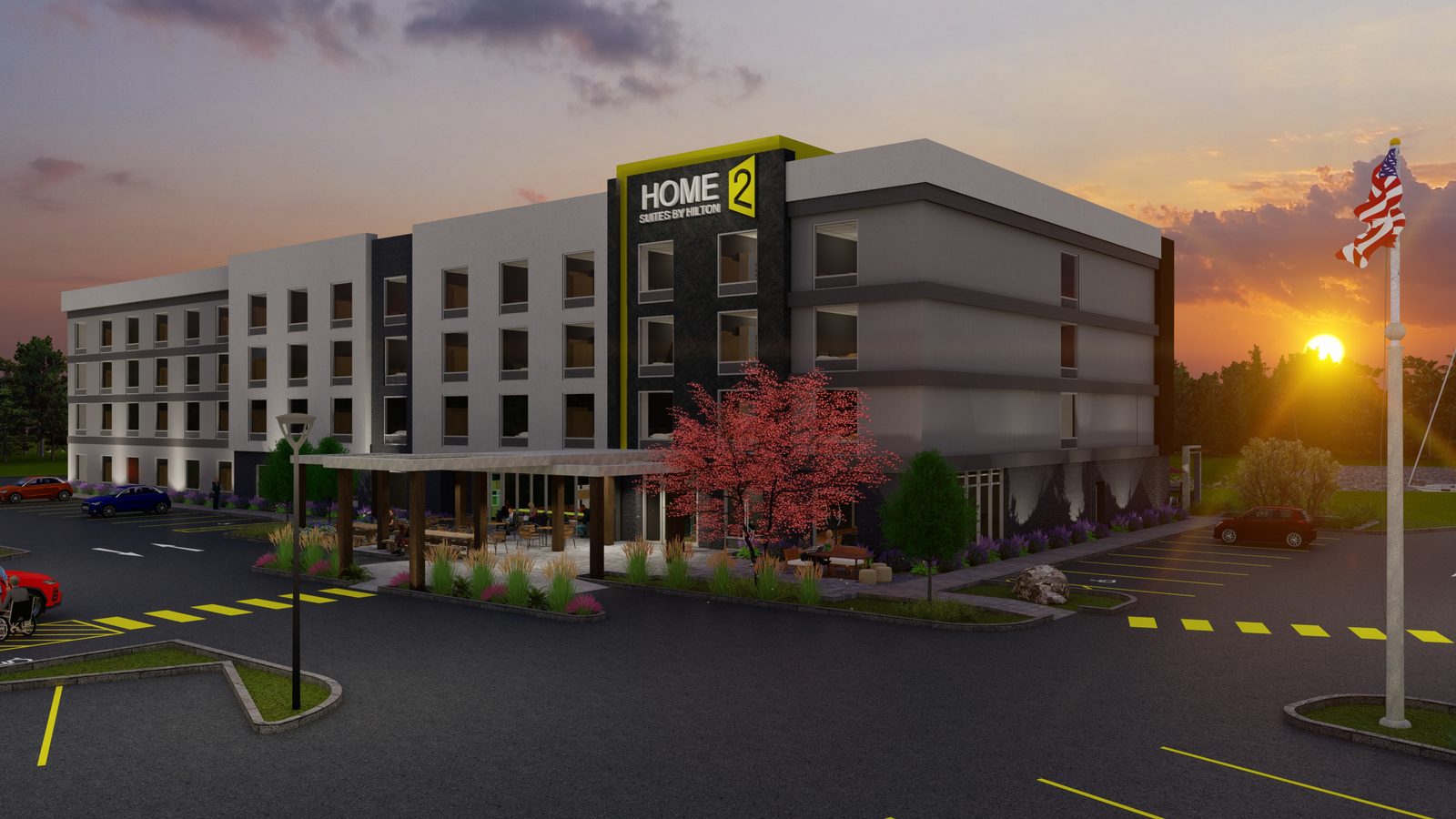 Sunset rendering of the proposed four-story Home2 Suites by Hilton in Independence, Michigan, showing the entry canopy, patio and parking.